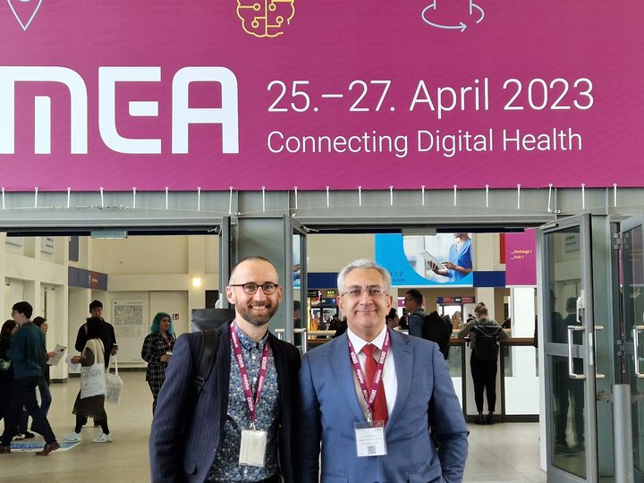 Selected photograph from DMEA 2023, showing colleagues and participants in conversation