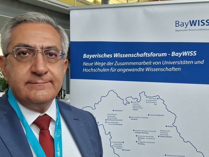 Selected photograph from BayWISS Academic Forum, showing a professional presentation or discussion