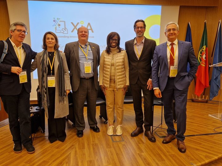 Selected photograph from XIA Alliance Kickoff, showing an event session with speakers and attendees