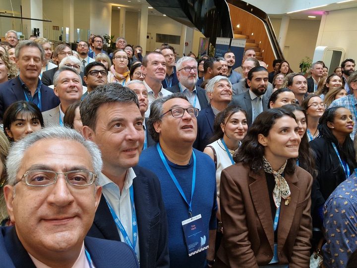 Prof. Georgi Chaltikyan taking a group selfie with symposium participants