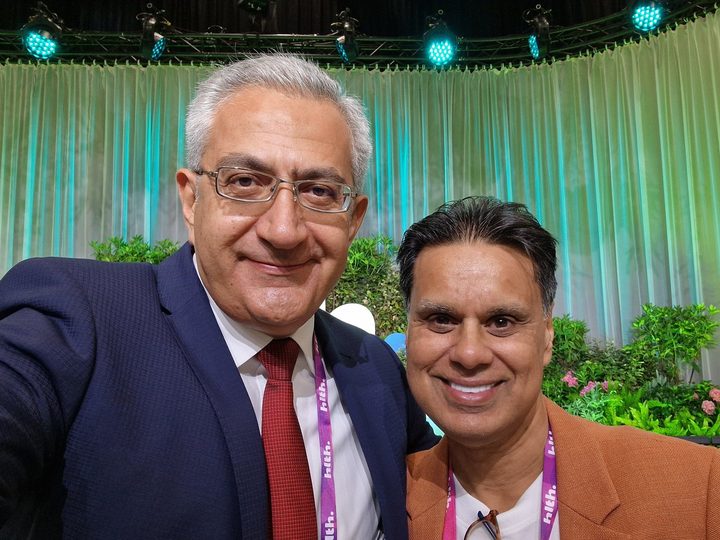 Prof. Georgi Chaltikyan with a fellow speaker at the HLTH Europe venue