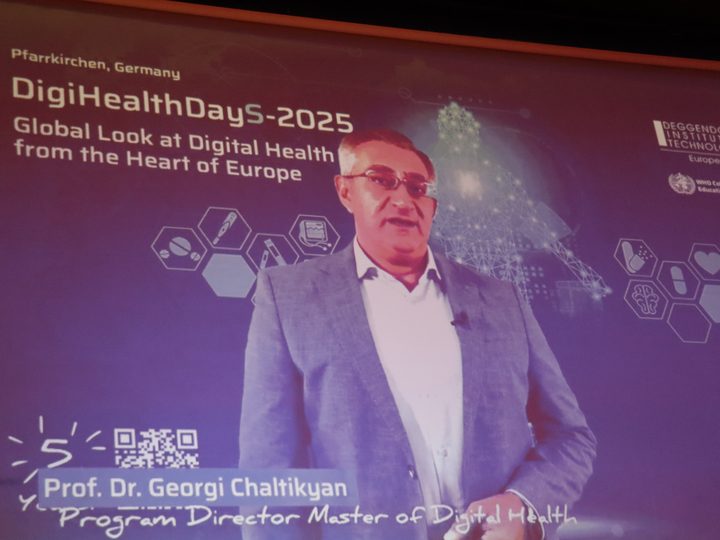 Prof. Georgi Chaltikyan addressing DigiHealthDayS-2025 remotely on the main stage screen