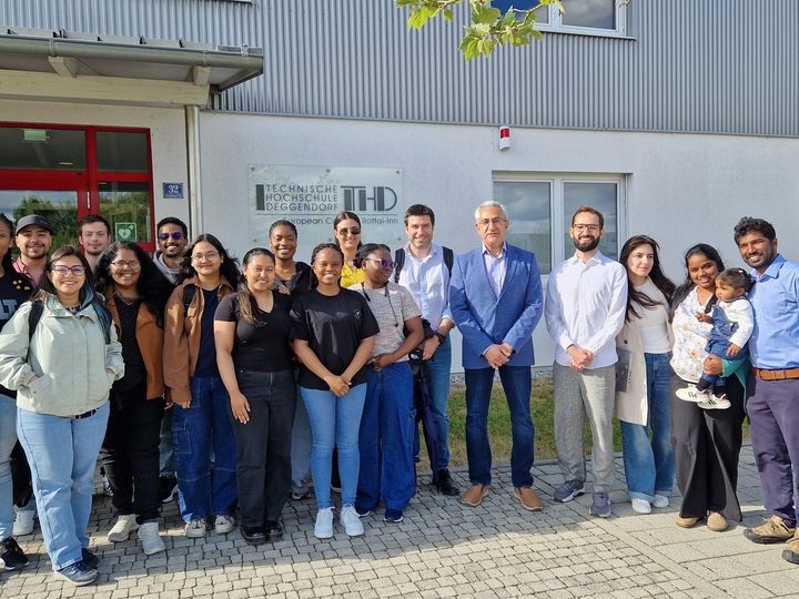 Prof. Georgi Chaltikyan with a large international student group outside ECRI