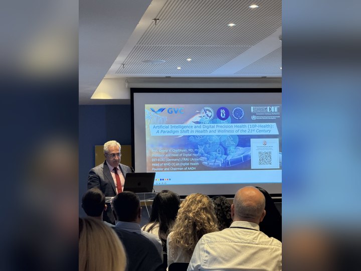 Prof. Georgi Chaltikyan presenting the future of digital health and precision health