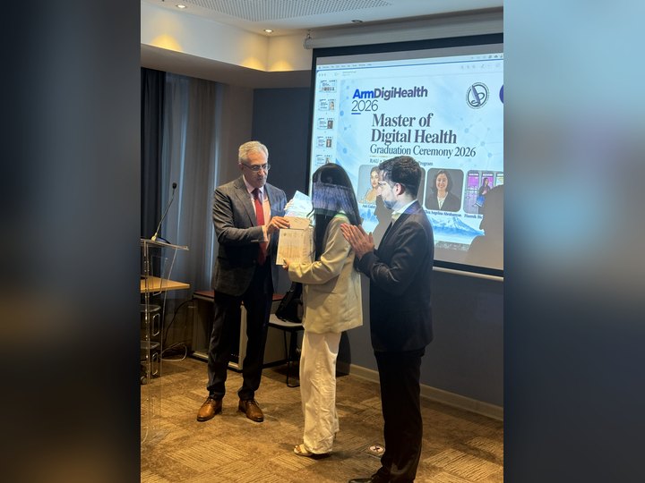 Prof. Georgi Chaltikyan congratulating a graduate at ArmDigiHealth-2026
