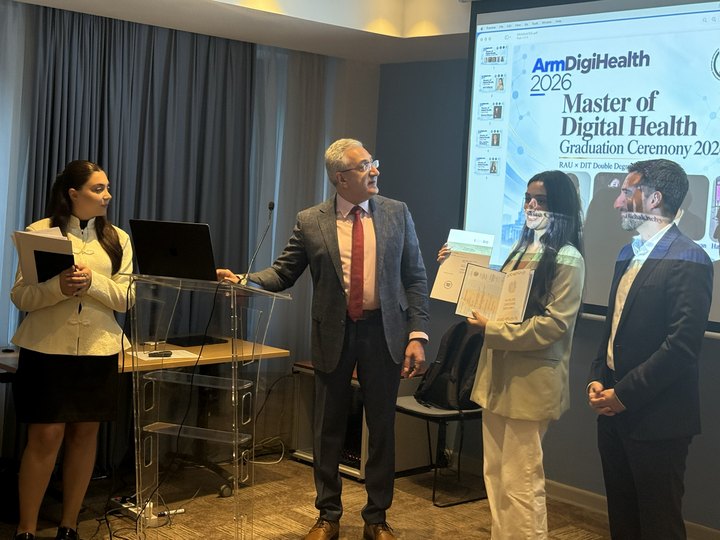Prof. Georgi Chaltikyan with a graduate and programme colleague